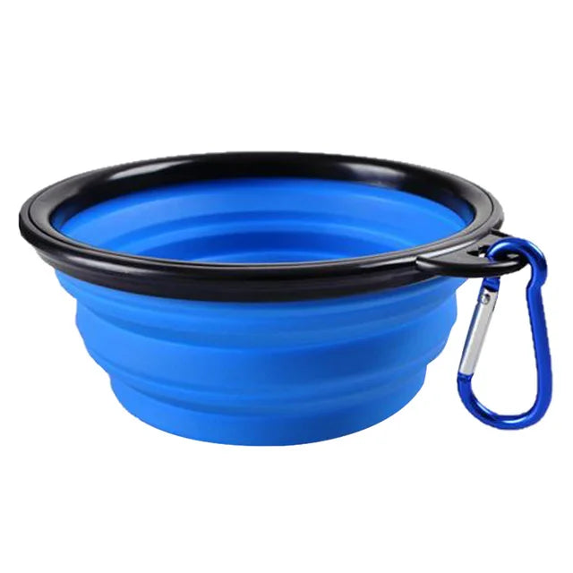 Blue collapsible pet travel bowl, folded flat with carabiner clip