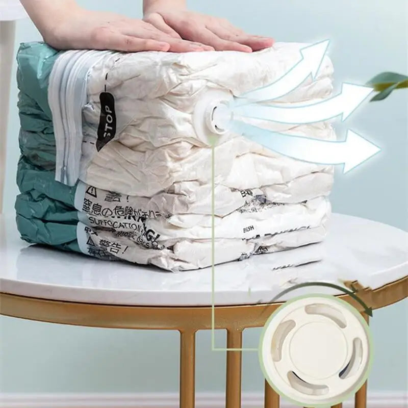 Hand pressing a compression storage bag to release air through the valve