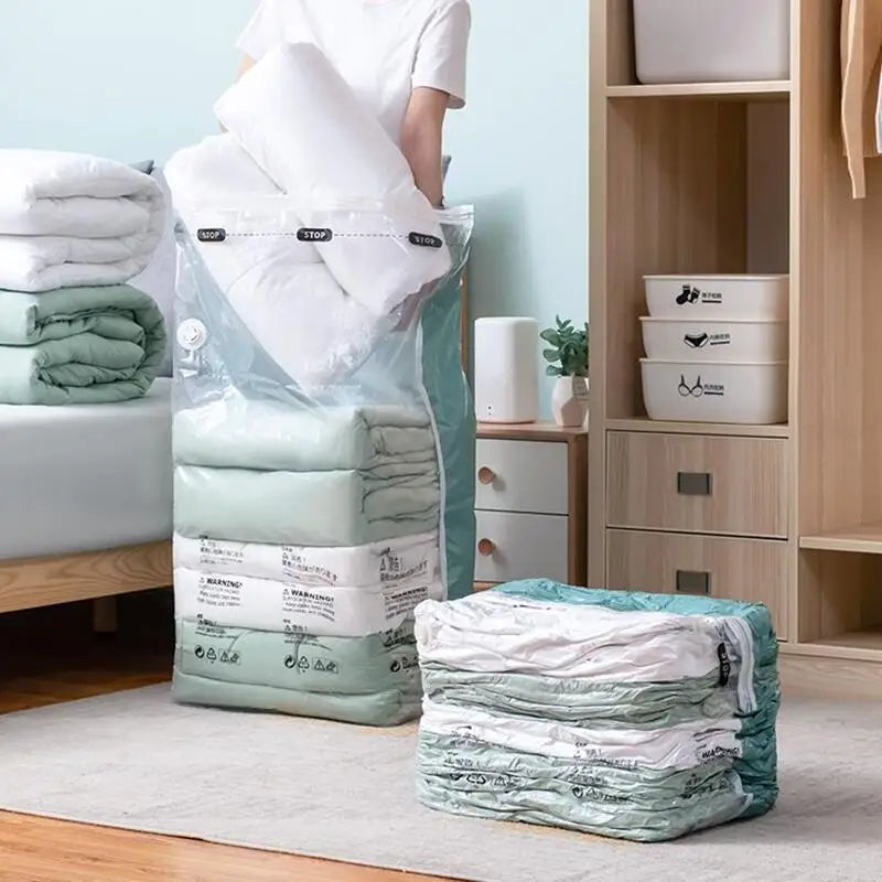 Compression storage bags folded and rolled, filled with folded linens